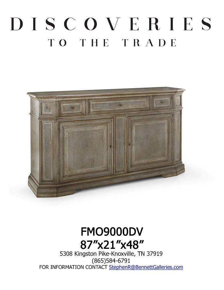 Distressed gray-taupe sideboard with three upper drawers and three cabinet doors, featuring carved molding detail, raised panel fronts, and angled corner posts on bracket feet.