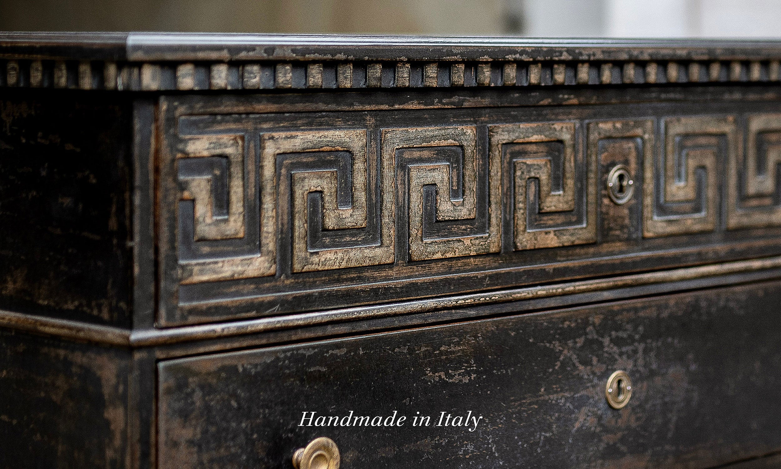 Close-up of a handcrafted Italian chest with a dark hand-applied finish