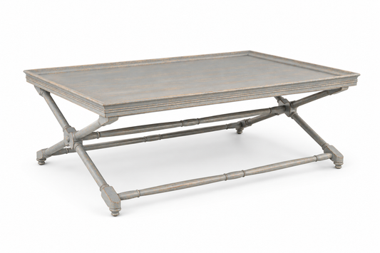 Vintage-style rectangular coffee table in distressed gray finish, featuring a tray-top wooden surface and elegant X-shaped faux bamboo base with turned feet and stretcher detail.