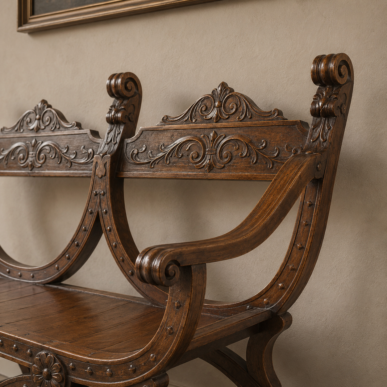 Ornate dark walnut wood bench with intricate Renaissance-style carved scrollwork, acanthus leaf motifs, curved X-frame legs with nail head trim, and decorative floral medallions.