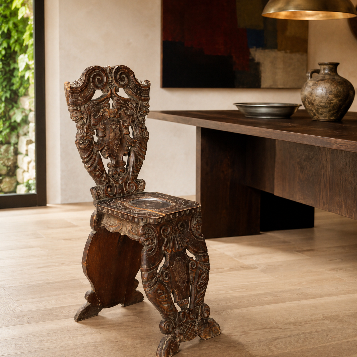 Ornately hand-carved dark walnut antique chair with elaborate Baroque scrollwork, heraldic motifs, intricate relief carvings, and decorative inlay on seat, displayed on light wood floor.