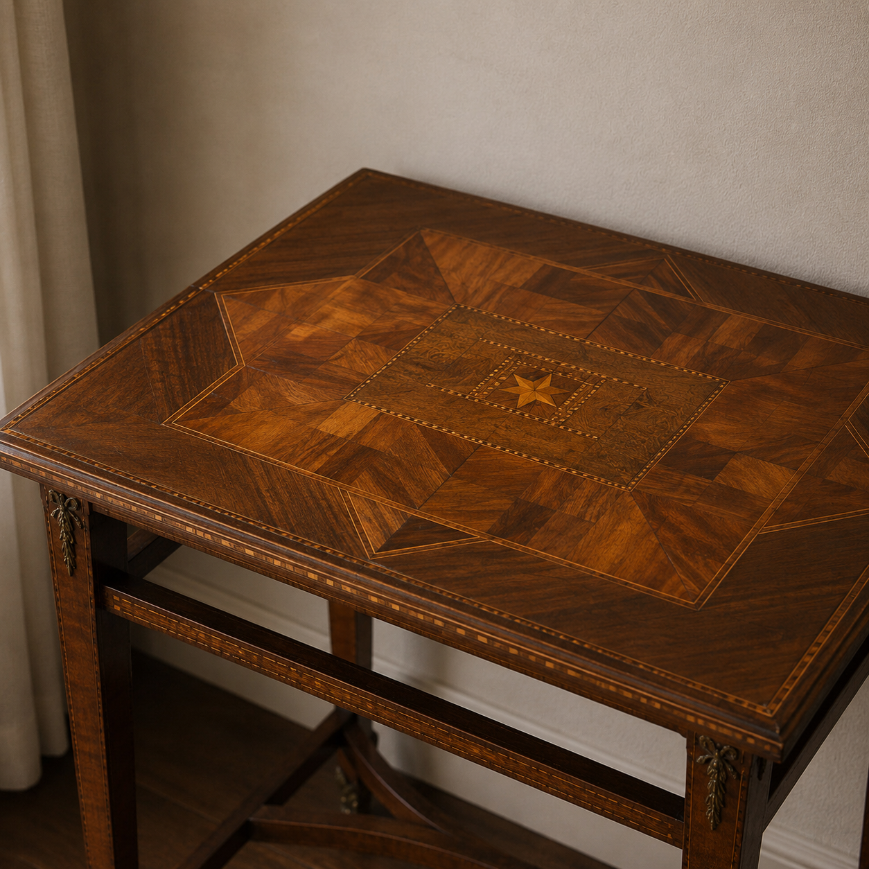 Antique-style marquetry side table with geometric parquetry top featuring a central star inlay, multi-toned walnut wood, decorative stringing, and bronze corner mounts on tapered legs.