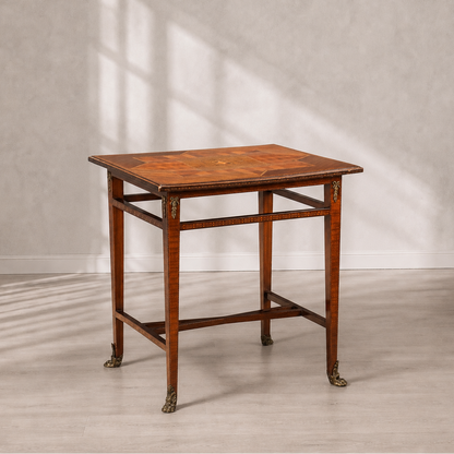 Antique-style rectangular side table with marquetry inlaid top in geometric star pattern, tapered legs with brass claw feet and decorative ormolu corner mounts, warm honey-brown wood tones