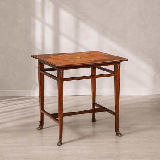 Antique-style rectangular side table with marquetry inlaid top in geometric star pattern, tapered legs with brass claw feet and decorative ormolu corner mounts, warm honey-brown wood tones