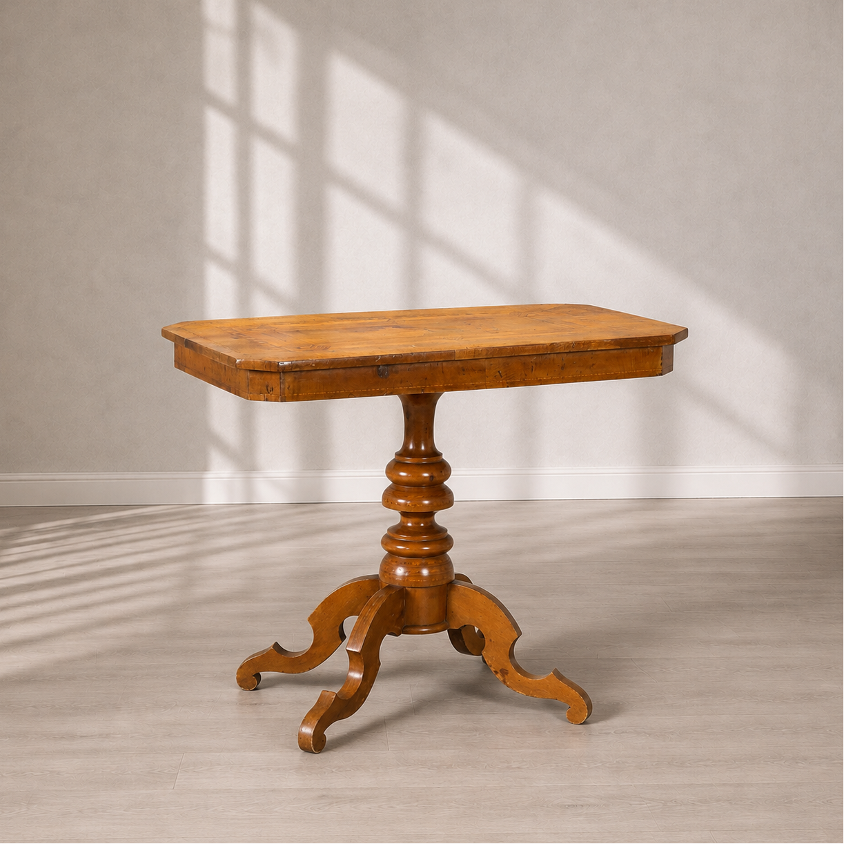 Antique-style walnut pedestal side table with rectangular top, turned column base, and ornate carved tripod legs with scrolled feet, warm honey-brown finish