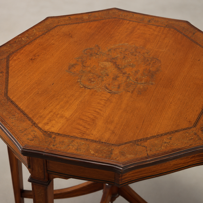 Antique octagonal side table in warm honey-brown wood with intricate floral marquetry inlay on top, decorative border banding, carved apron, and elegant curved stretcher base.