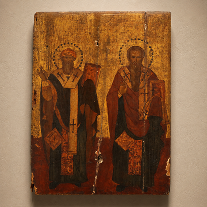 Antique Eastern Orthodox wooden icon panel depicting two bearded saints in episcopal vestments with halos, gold background, crackled paint, religious art