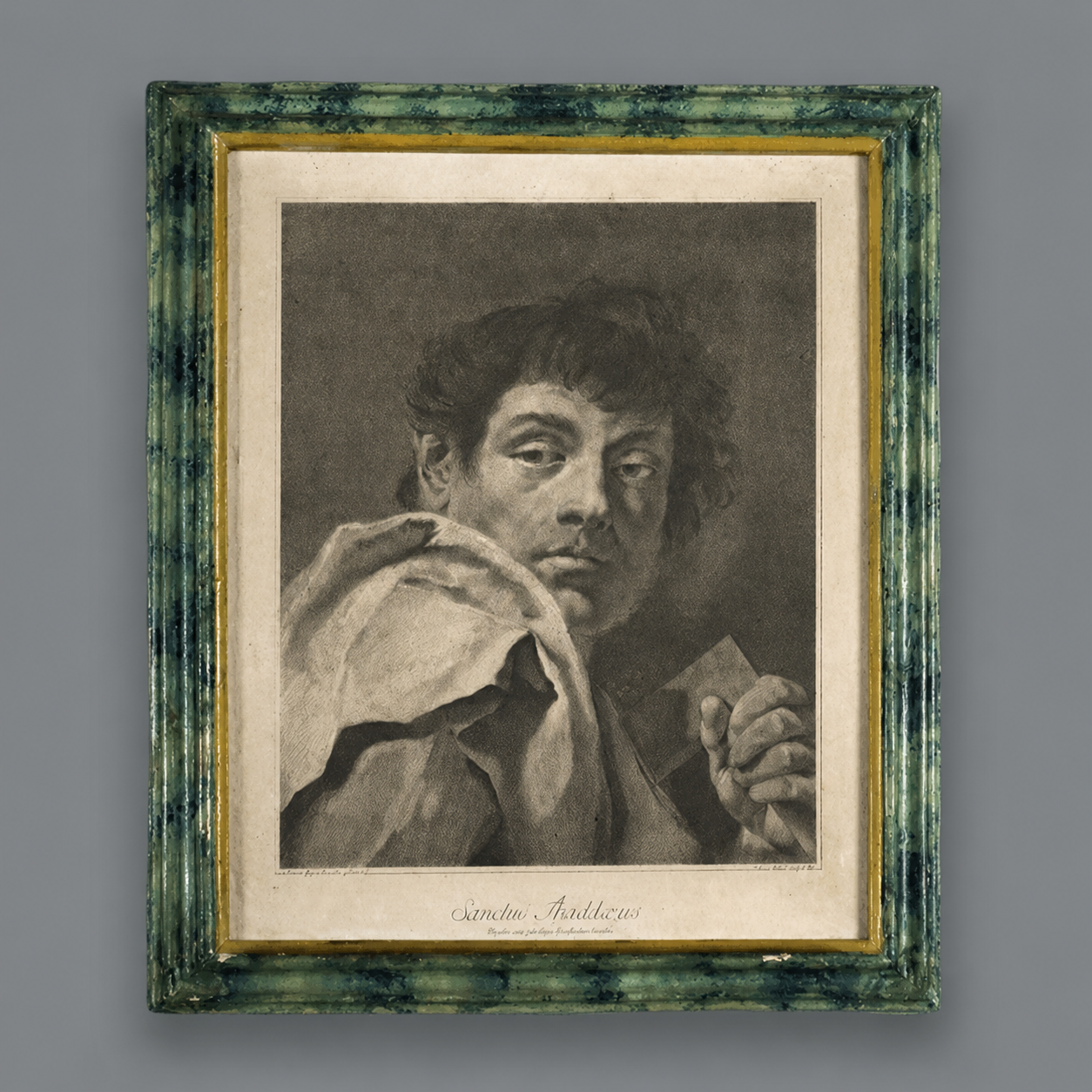 Antique framed mezzotint engraving 'Sanctus Thaddaeus' depicting a male figure, housed in a green marbled wood frame with gilt inner border, aged sepia tones.