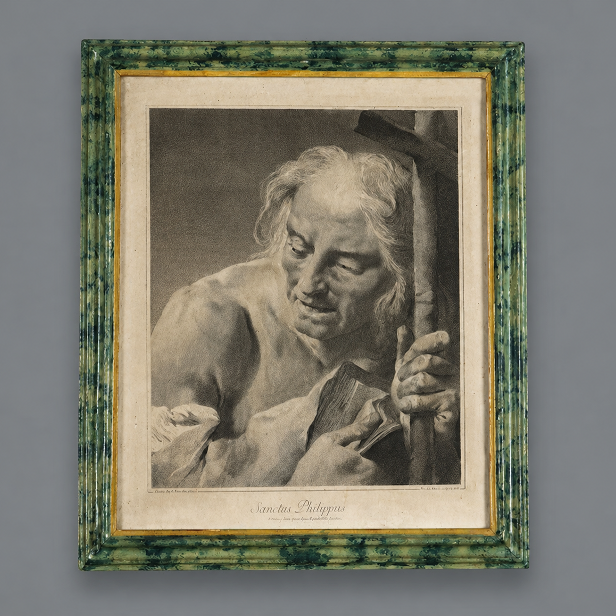 Framed engraving 'Sanctus Philippus' depicting Saint Philip, black and white print in ornate green marbled frame with gold inner border, classical religious art.