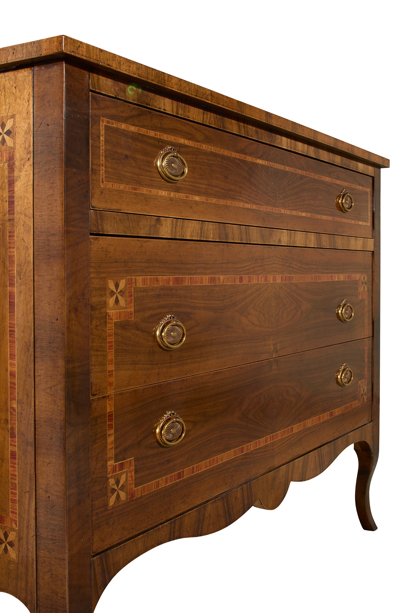 Traditional walnut chest of drawers with intricate marquetry inlay work, featuring decorative cross patterns, curved apron base, and ornate brass rosette pulls on four graduated drawers