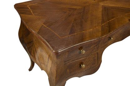 Curved bombe-style wooden chest with rich walnut finish featuring decorative wood grain patterns, two drawers with brass knobs, and elegant curved legs in traditional design