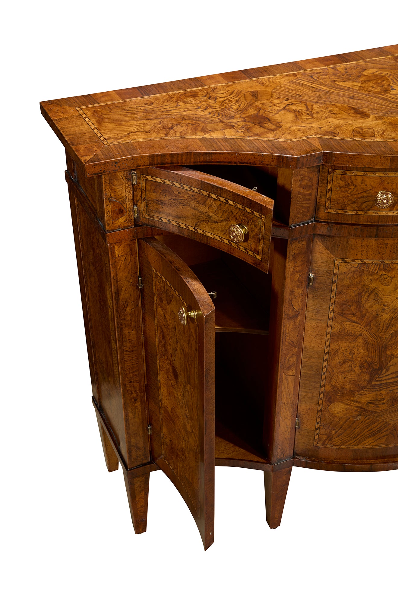 Curved corner cabinet in rich brown wood with burled veneer panels, featuring brass hardware, multiple doors and drawers, tapered legs, and sophisticated traditional craftsmanship