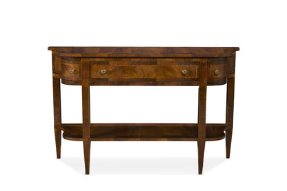 Traditional demilune console table in rich brown walnut wood with curved front, four brass knob drawers, lower shelf, and tapered legs showcasing elegant grain patterns