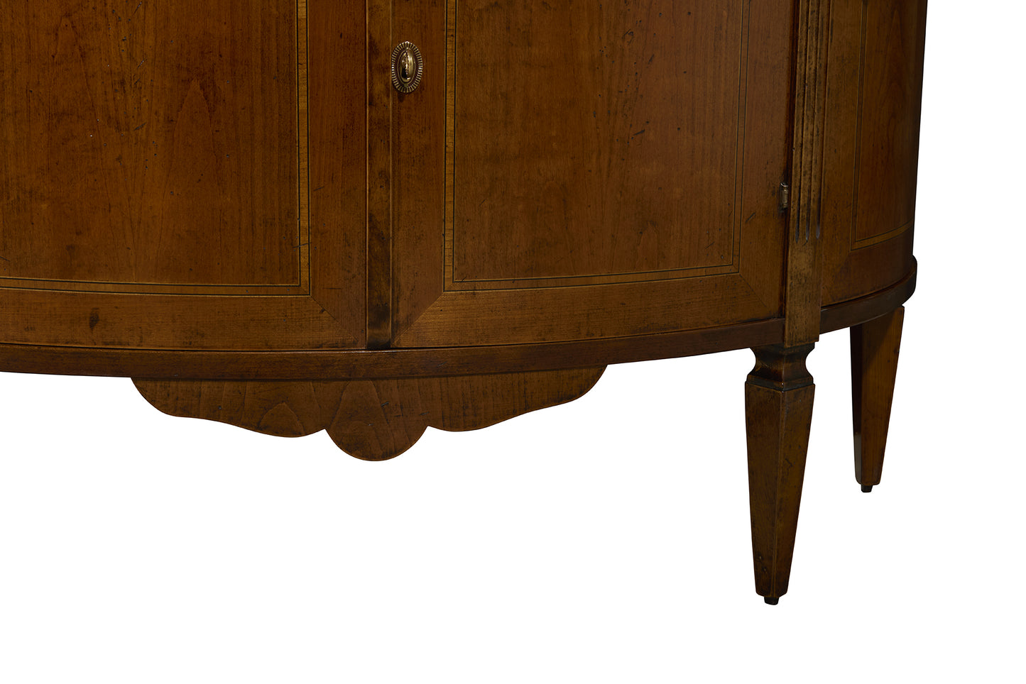 Vintage-style wooden cabinet with rich brown finish, decorative keyhole escutcheon, scalloped apron, and tapered legs