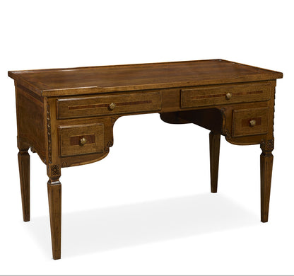 Traditional brown wooden desk with four drawers, curved apron detail, and tapered legs with decorative carved accents