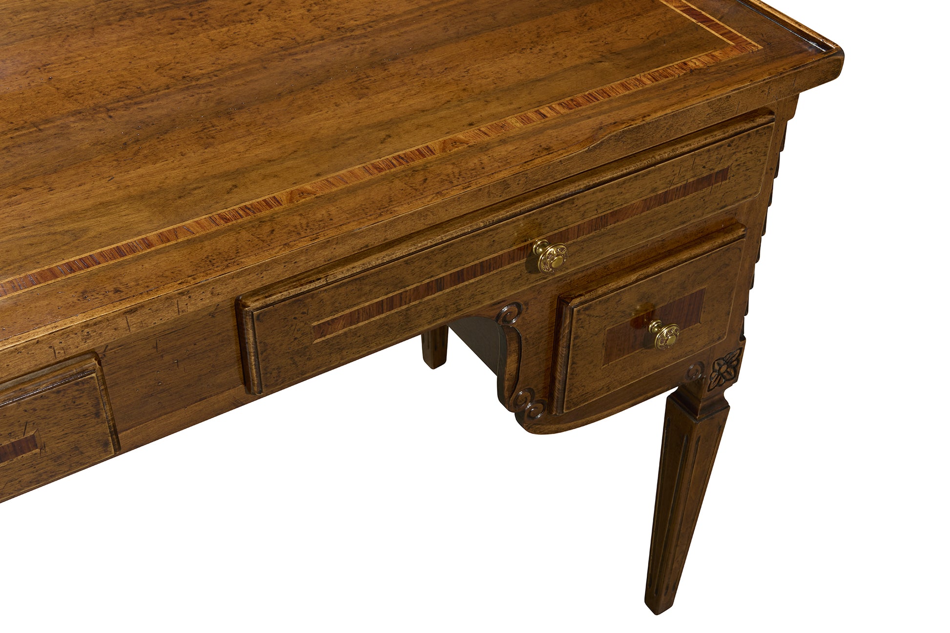 Walnut-finished wooden desk with decorative inlay trim, brass hardware, and curved leg details on white background