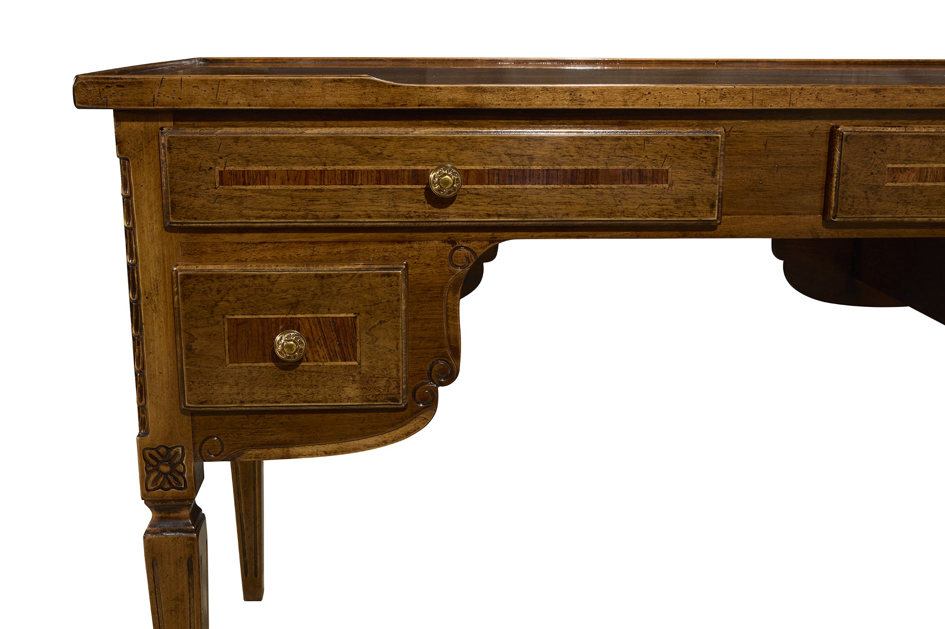 Traditional wooden desk with carved details, brass hardware, multiple drawers, and decorative curved apron in warm brown f...