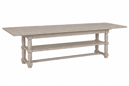 Farmhouse-style distressed gray wood console table with turned legs, lower shelf, and extension leaves, featuring a weathered whitewash finish and stretcher base.