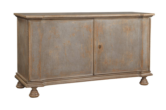 Weathered gray wooden sideboard chest with distressed finish, featuring two flat panel doors, decorative turned feet, and molded top edge in traditional European style