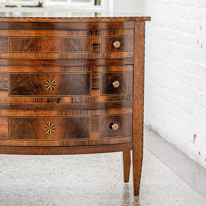 Traditional walnut chest with three drawers featuring decorative star inlays and brass knob hardware. Rich brown wood grain with light-colored trim details on tapered legs.