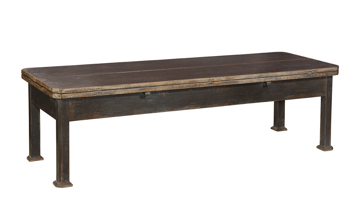 Rustic wooden bench with weathered brown finish and distressed patina. Features rectangular top with storage compartment and sturdy legs with metal accents at base.
