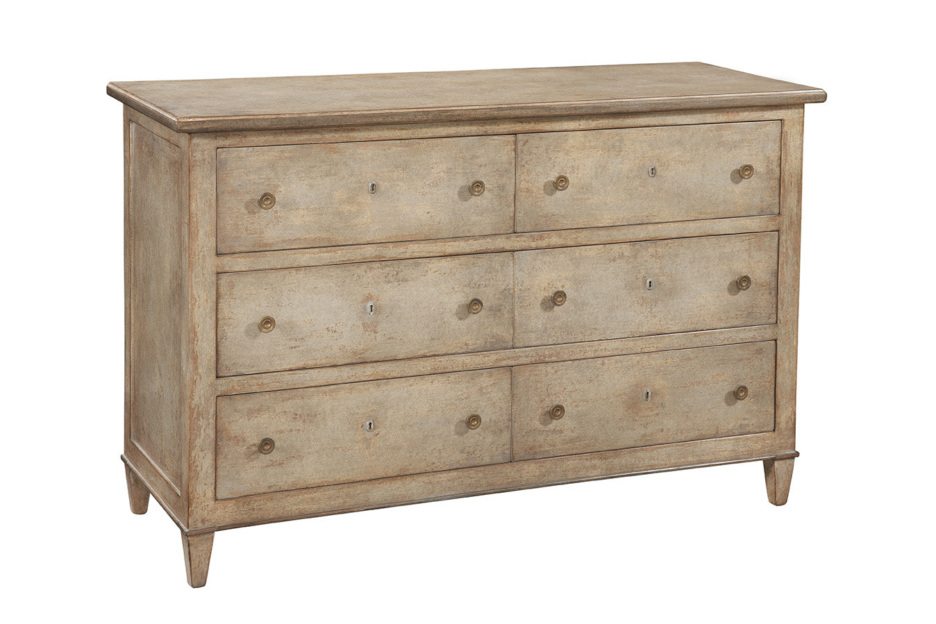 Traditional six-drawer dresser in weathered light brown wood finish with brass hardware, featuring three rows of paired drawers and tapered legs