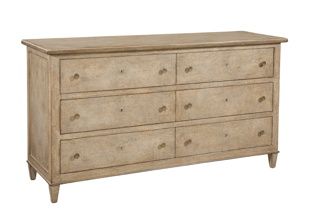 Traditional six-drawer dresser in weathered light brown wood finish with antique brass round knobs and keyhole details, featuring tapered legs and classic proportions