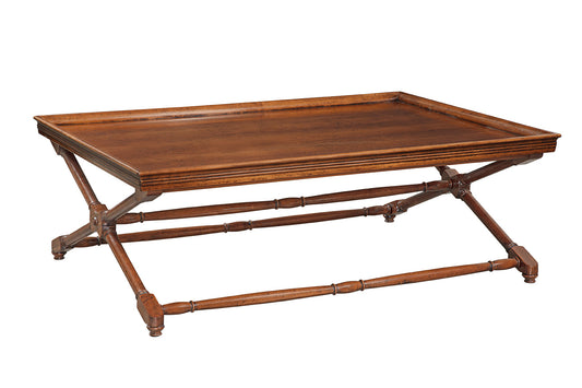 Traditional wooden coffee table with tray-style top featuring raised edges and X-shaped folding base with bamboo-turned stretchers in rich brown finish