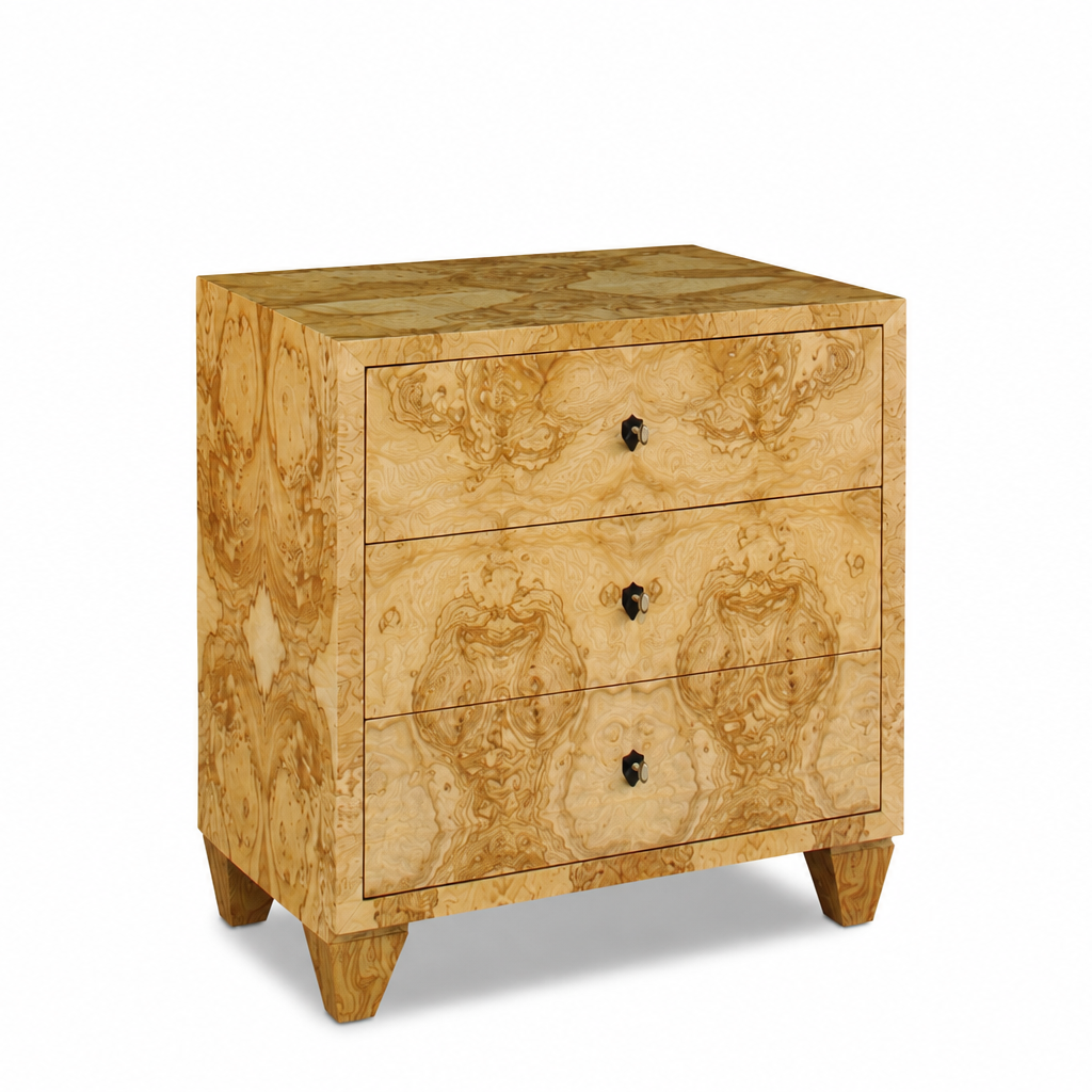 Three-drawer chest with luxurious burl wood veneer in golden honey tones, featuring symmetrical grain patterns, dark knob hardware, and tapered block feet.